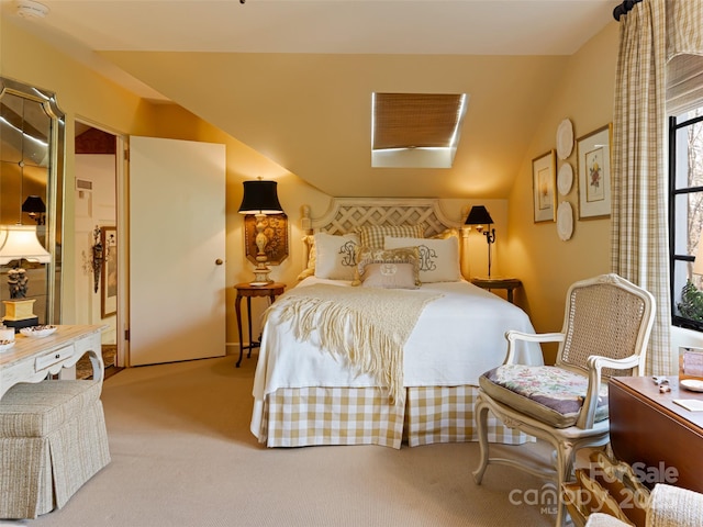 carpeted bedroom with lofted ceiling