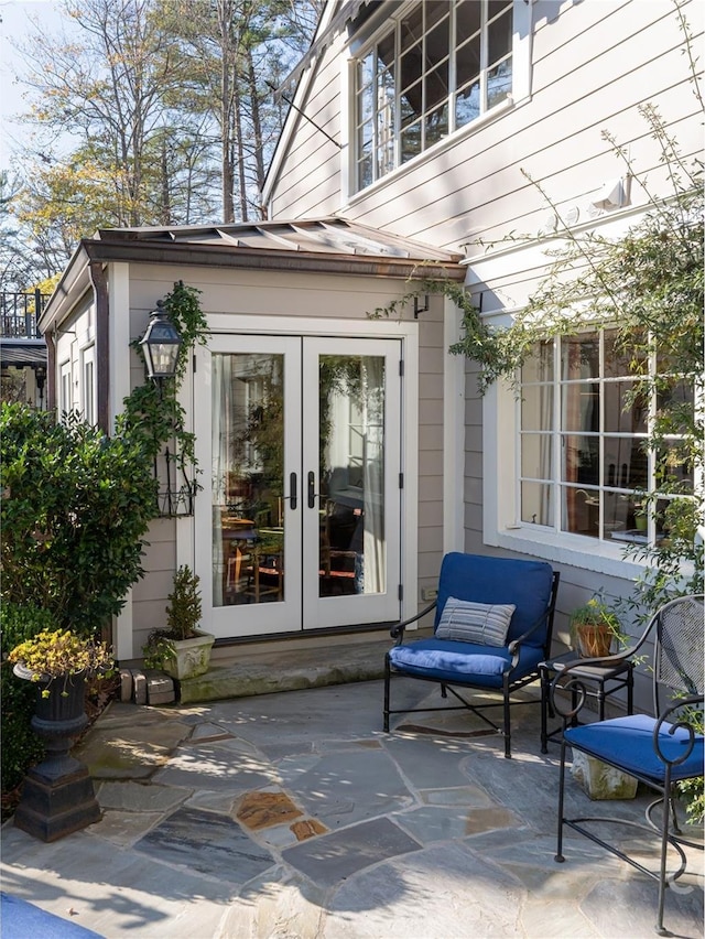 doorway to property featuring a patio and french doors