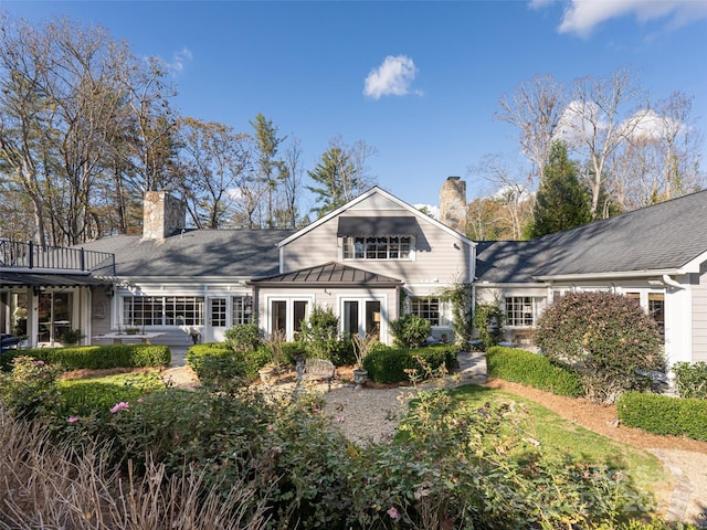 back of property featuring french doors