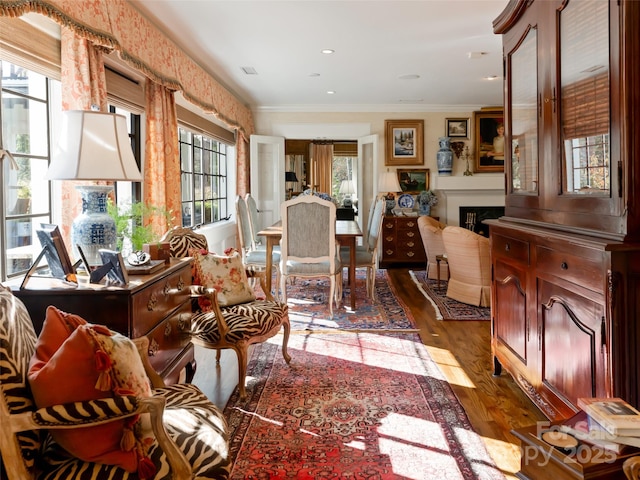 interior space with dark wood-type flooring and ornamental molding