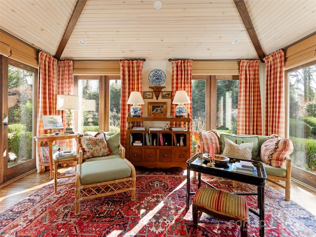 interior space featuring beamed ceiling, wooden ceiling, and a wealth of natural light