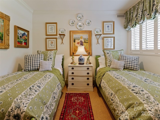 bedroom featuring carpet flooring and ornamental molding