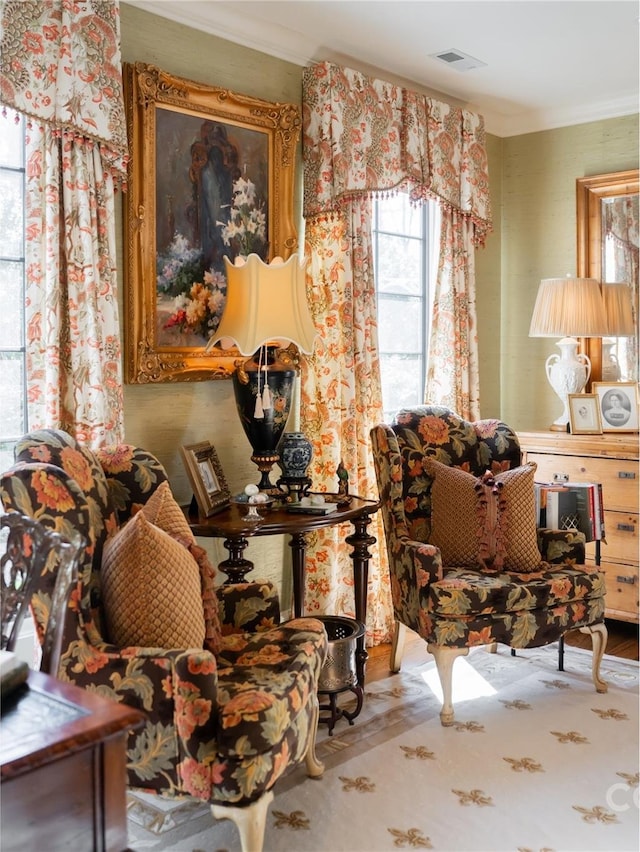 sitting room featuring ornamental molding