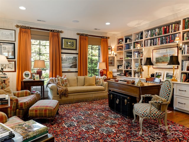 office featuring a wealth of natural light, crown molding, and hardwood / wood-style floors