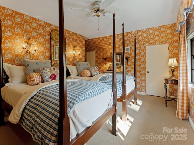 bedroom featuring ceiling fan and light carpet