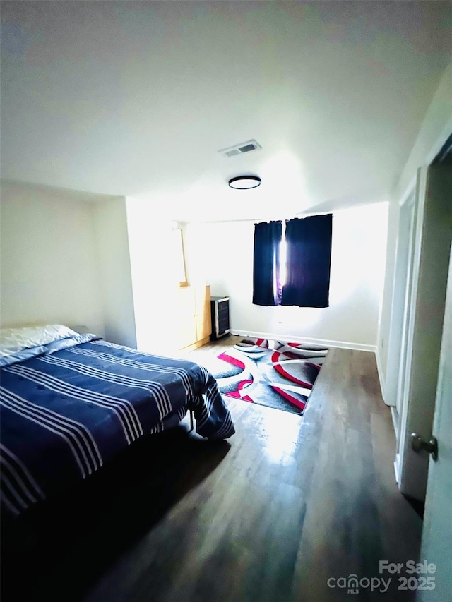 bedroom featuring wood-type flooring