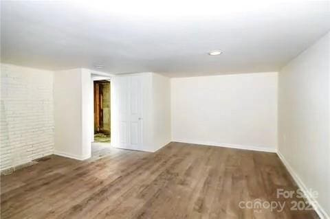 basement with dark wood-type flooring