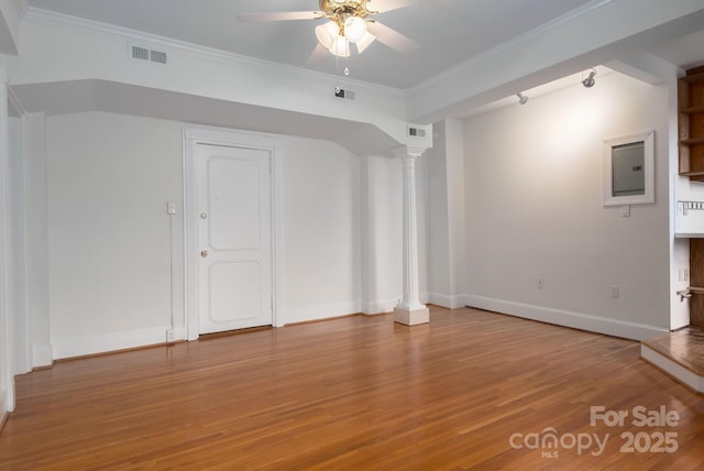 interior space featuring hardwood / wood-style floors, ornate columns, and ceiling fan