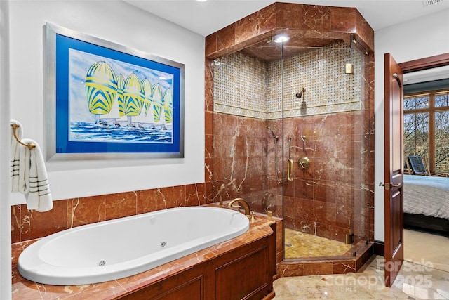 bathroom featuring shower with separate bathtub