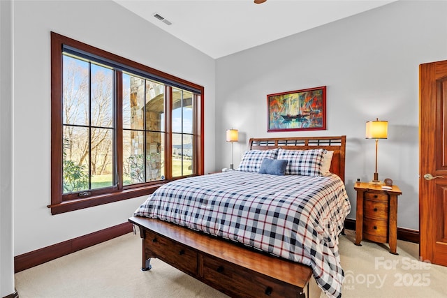 bedroom featuring light colored carpet