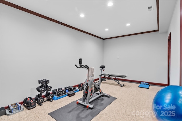 workout area with carpet flooring and crown molding