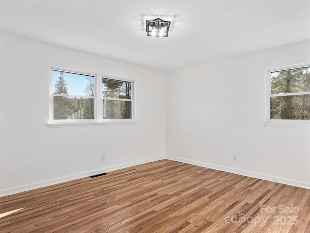 spare room featuring hardwood / wood-style floors