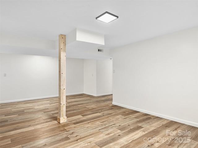 basement featuring light wood-type flooring