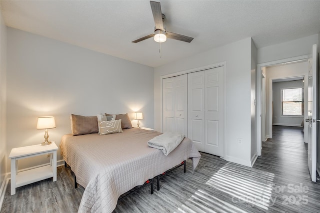 bedroom featuring ceiling fan, hardwood / wood-style floors, a closet, and a textured ceiling