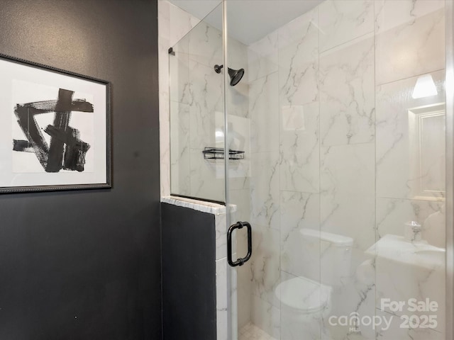 bathroom with an enclosed shower and toilet