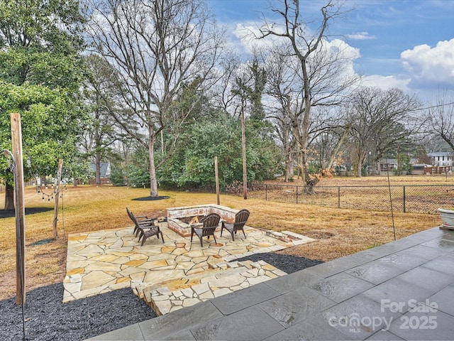 view of patio / terrace with an outdoor fire pit