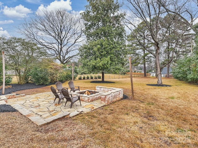 view of yard with a patio area and an outdoor fire pit