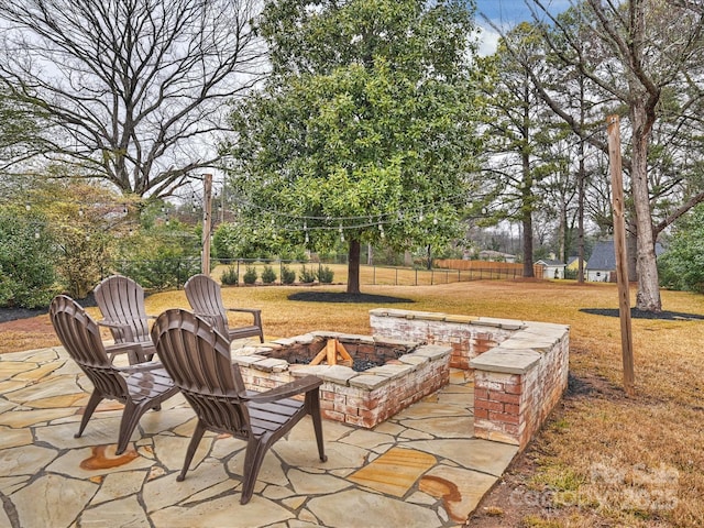 view of patio / terrace with an outdoor fire pit