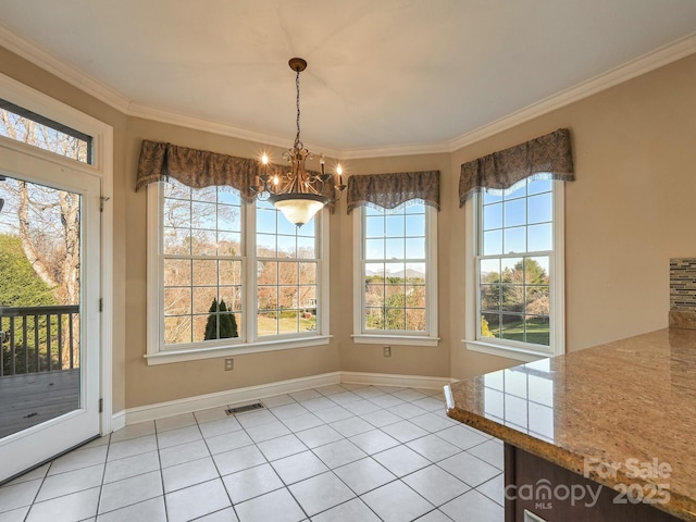 unfurnished dining area featuring a chandelier, ornamental molding, and light tile patterned flooring