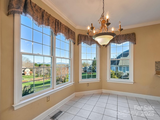 unfurnished dining area featuring crown molding, light tile patterned floors, and an inviting chandelier