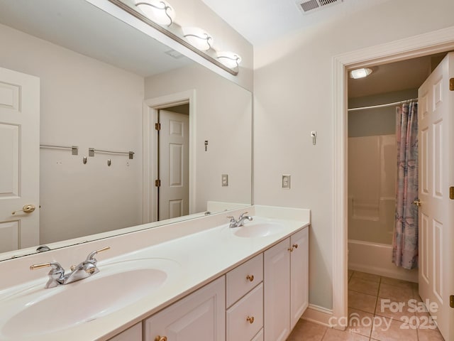 bathroom with tile patterned flooring, vanity, and shower / tub combo with curtain