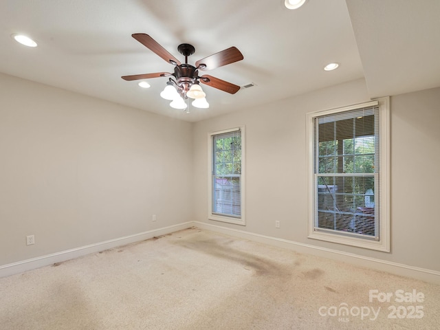 unfurnished room with light carpet and ceiling fan