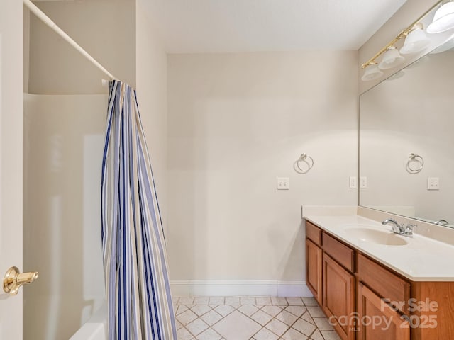 bathroom featuring vanity, tile patterned floors, and shower / bath combo with shower curtain