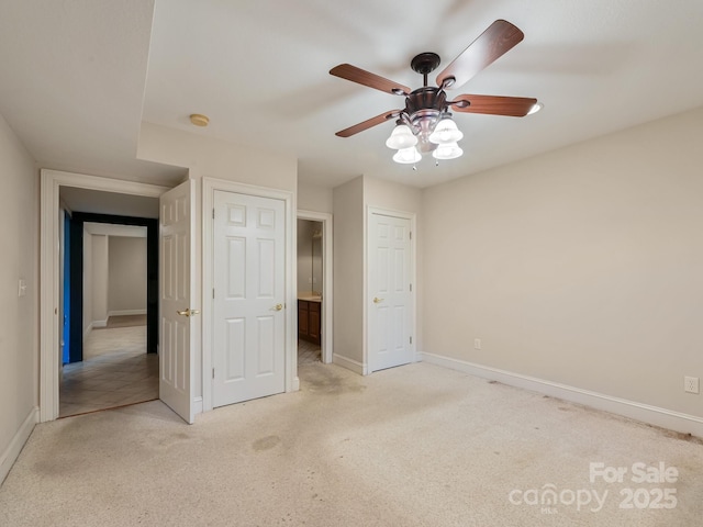 unfurnished bedroom featuring light carpet and ceiling fan