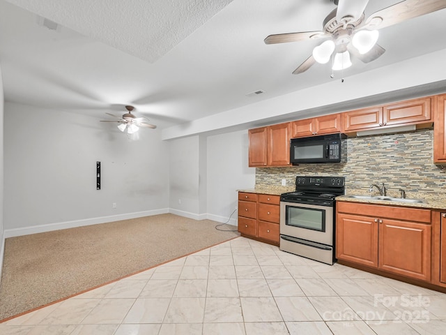 kitchen featuring sink, ceiling fan, stainless steel electric range oven, tasteful backsplash, and light colored carpet