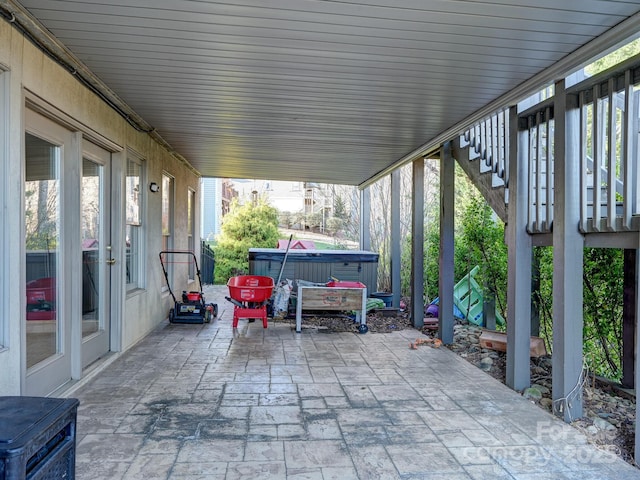 view of patio / terrace featuring a hot tub