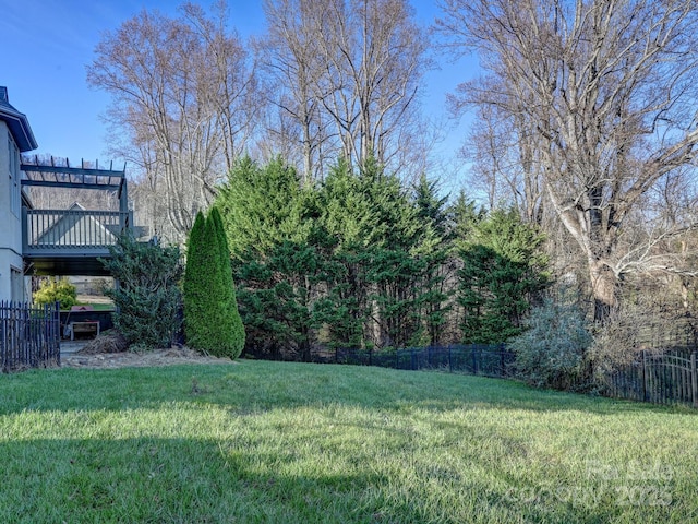 view of yard featuring a wooden deck