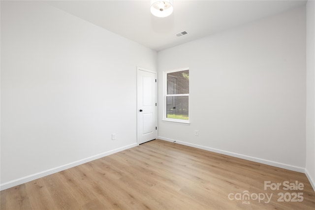 unfurnished room with light hardwood / wood-style flooring