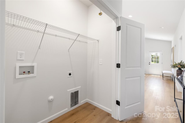 laundry area featuring hookup for an electric dryer, hookup for a washing machine, gas dryer hookup, and light wood-type flooring