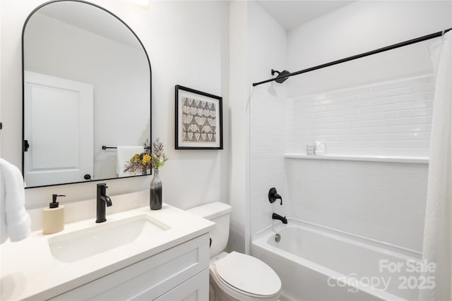 full bathroom featuring vanity, shower / bath combination with curtain, and toilet