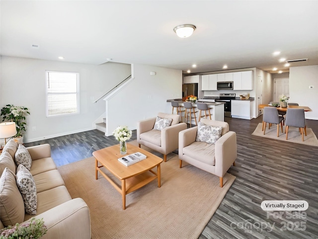 living room featuring dark hardwood / wood-style floors