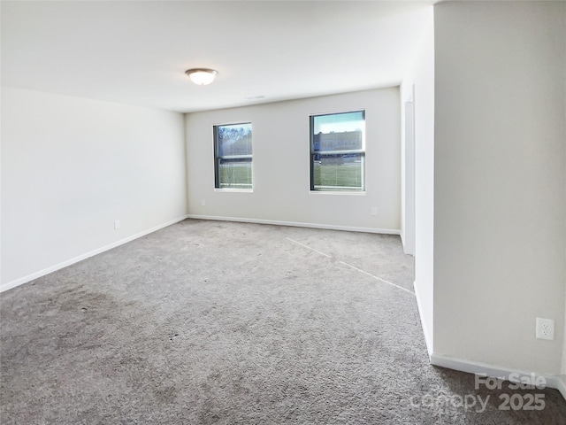 empty room featuring light colored carpet