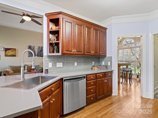 kitchen featuring light wood-style flooring, decorative backsplash, stainless steel dishwasher, ornamental molding, and a sink