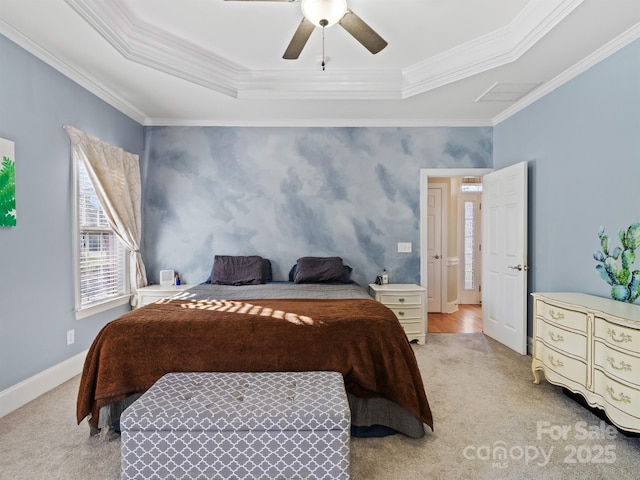 bedroom with ornamental molding, a tray ceiling, light carpet, and baseboards