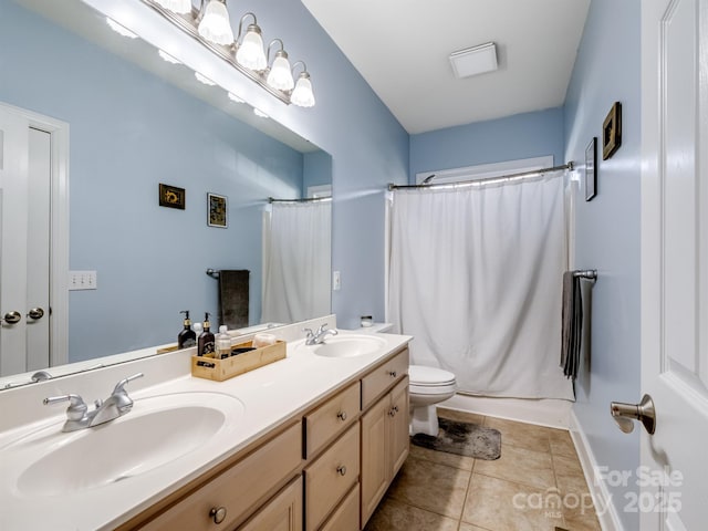 full bathroom with tile patterned flooring, a sink, toilet, and a shower with curtain