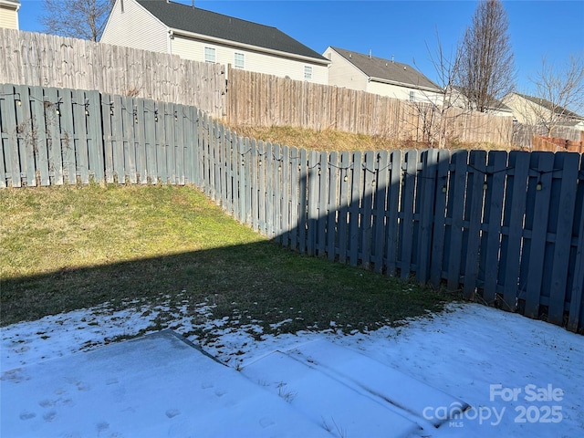 view of yard layered in snow