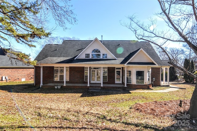 view of front of house featuring french doors and a front yard