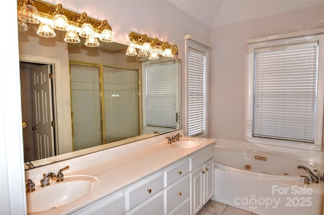 bathroom featuring independent shower and bath, tile patterned flooring, lofted ceiling, and vanity