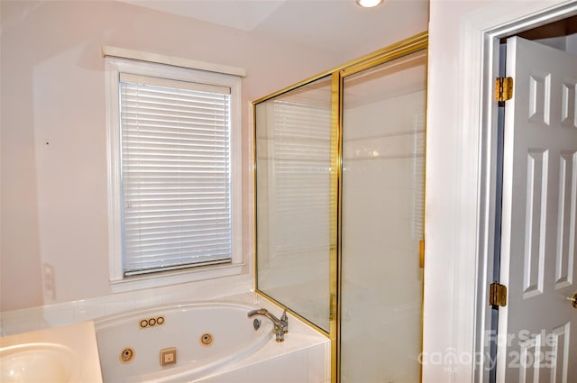 bathroom featuring sink and plus walk in shower