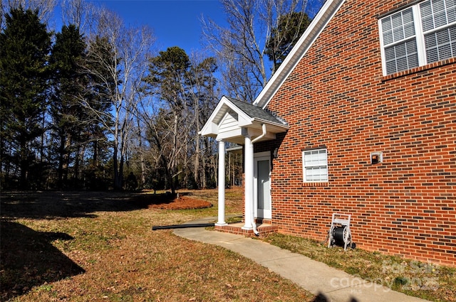 view of property exterior featuring a yard