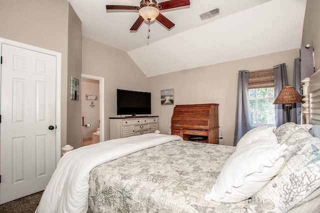 bedroom featuring carpet, ceiling fan, lofted ceiling, and ensuite bath