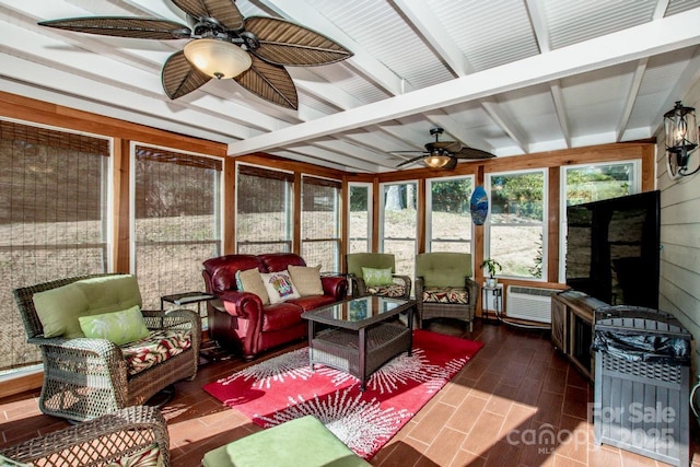 sunroom with ceiling fan and lofted ceiling