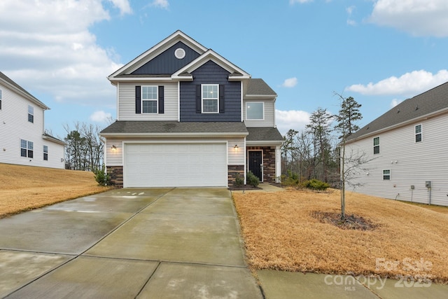 view of front of house with a front lawn and a garage