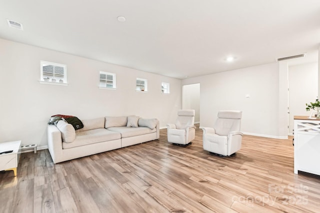 unfurnished living room featuring light wood-type flooring