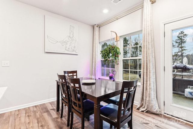 dining room with hardwood / wood-style floors