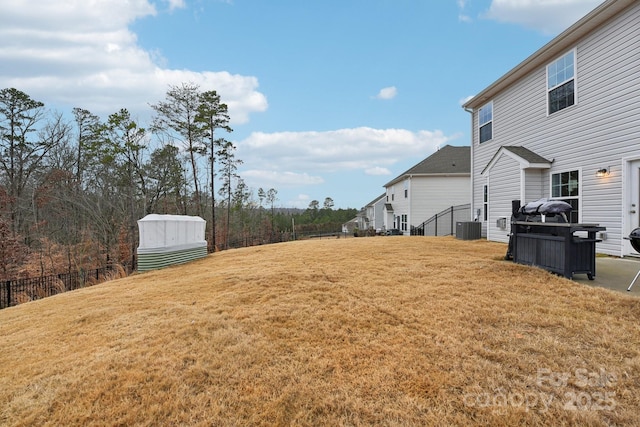 view of yard featuring central AC unit